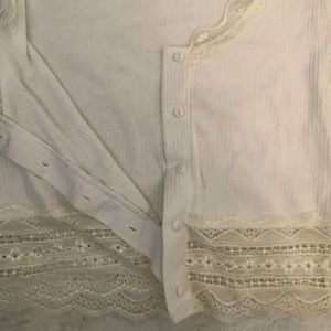 This is a button up white crop top.
